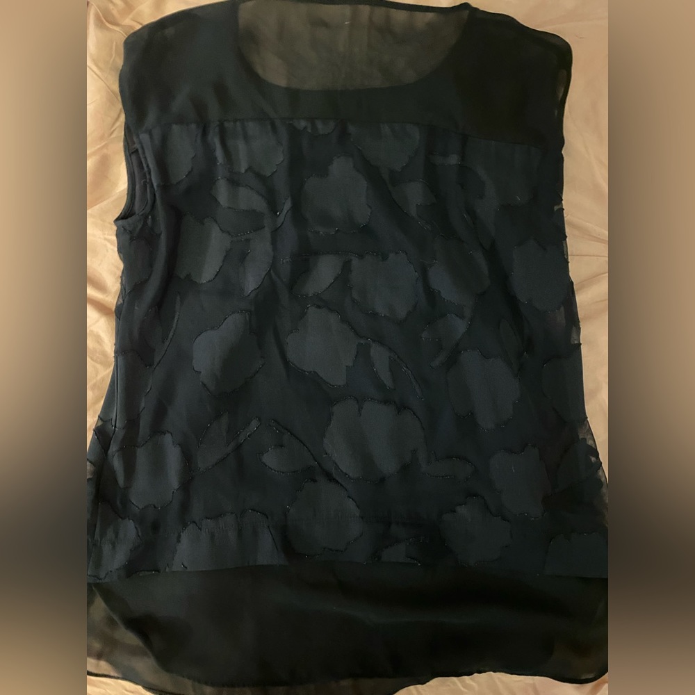 Black dress wear tank top with ruffles.